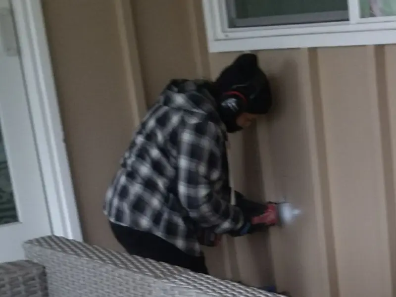 Professional electrician installing an exterior outlet in Natick